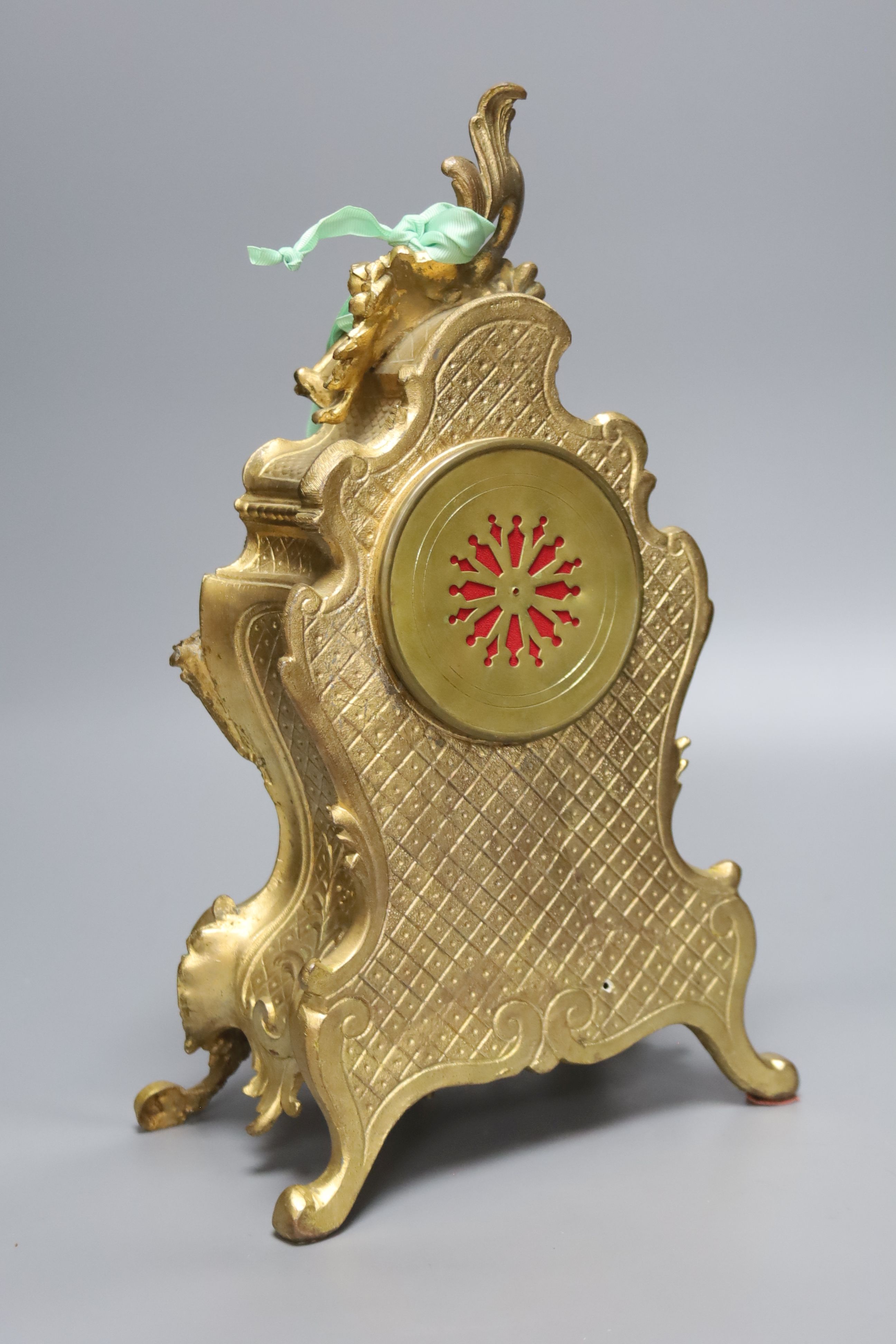 An early 20th century French gilt metal and porcelain eight day mantel clock, height 37cm